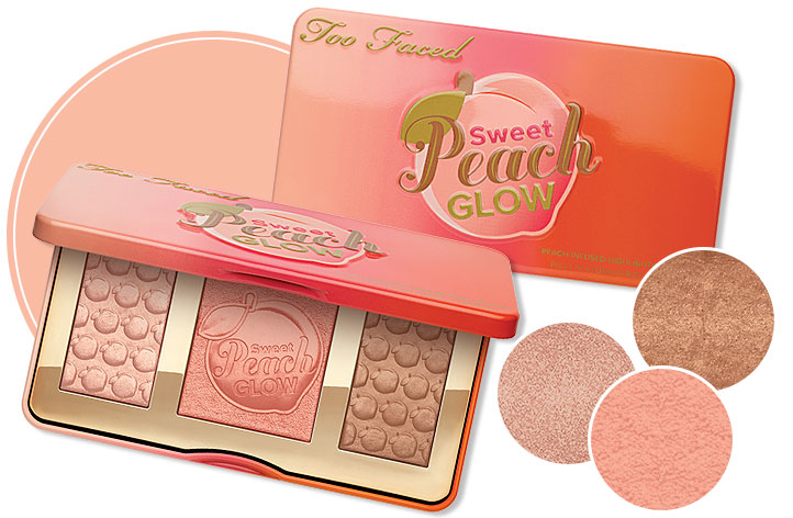 Too Faced Sweet Peach Glow Highlighting Palette is propped open displaying the blush, bronzer and highlighter. The container has a huge peach on it, and the powders have peaches stamped into them.